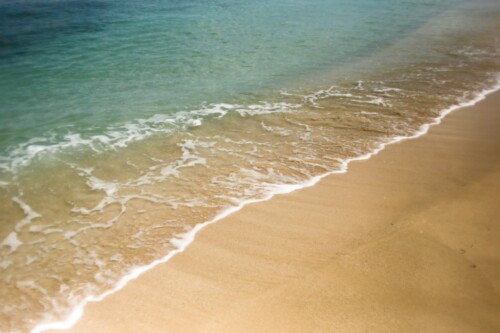 wave hitting beach