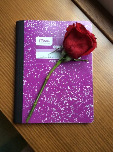 A rose on a notebook